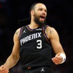 The Canadian star celebrating a game-winning basket with an emotional reaction as the crowd erupts in celebration