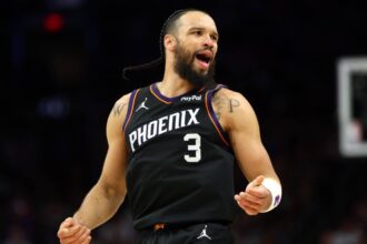 The Canadian star celebrating a game-winning basket with an emotional reaction as the crowd erupts in celebration