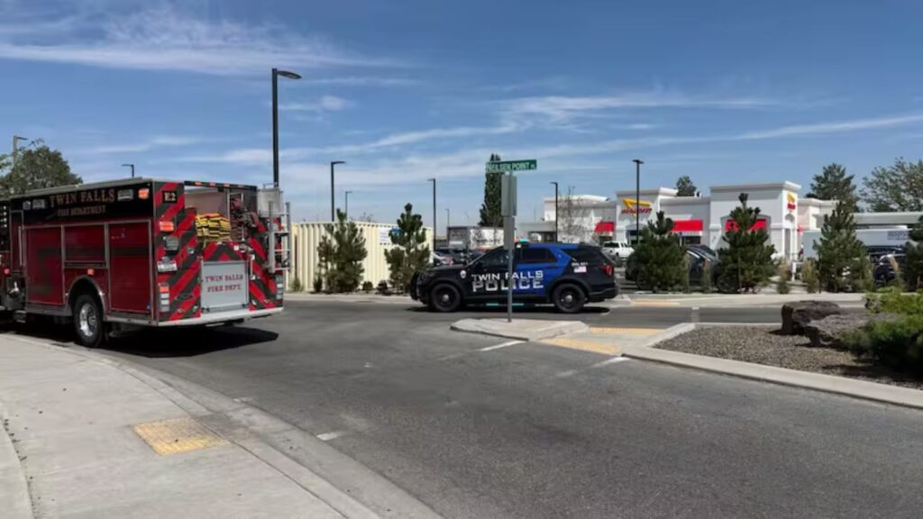 A fire truck and several police vehicles surrounding the restaurant where the shooting occurred