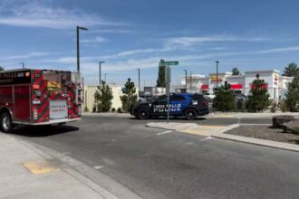 A fire truck and several police vehicles surrounding the restaurant where the shooting occurred