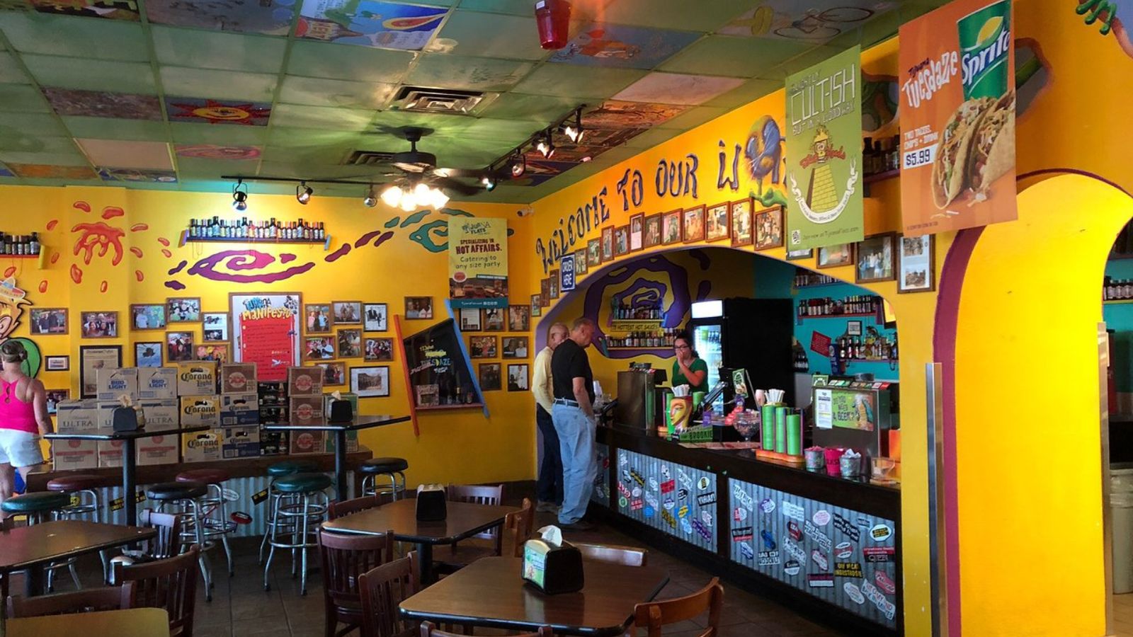 A view of a traditional Mexican restaurant featuring colorful décor, vibrant murals, handcrafted ornaments, and authentic elements inspired by Mexican culture and heritage