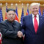 Trump reduces military exercises with South Korea in gesture toward Kim Jong-un Senior officials from both countries shaking hands as a gesture of goodwill