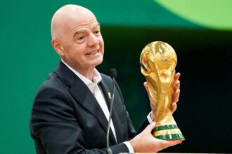 UEFA prepares criminal complaint against FIFA president Gianni Infantino Infantino holding the World Cup trophy at a press conference