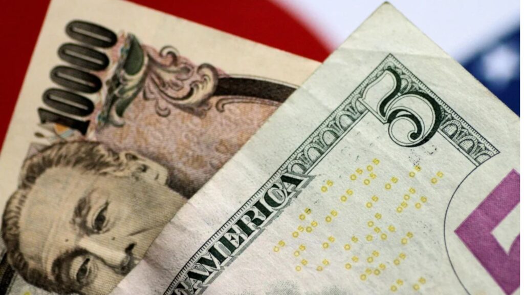 Two banknotes, one a 5-dollar bill and the other a 10,000-yen note, placed one on top of the other