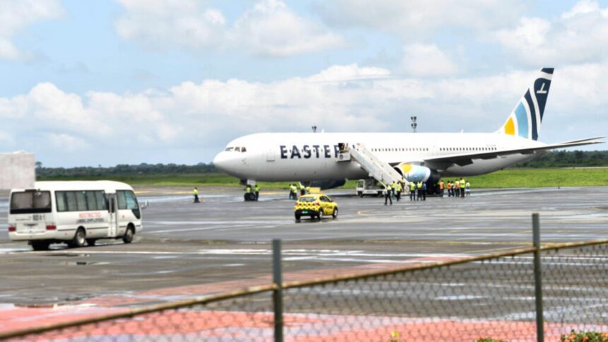 An airplane being boarded by several people who will be deported to Liberia