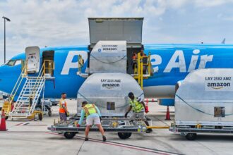A large Amazon plane being loaded with products to be shipped to other countries and cities