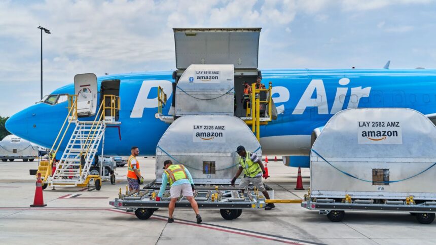 A large Amazon plane being loaded with products to be shipped to other countries and cities