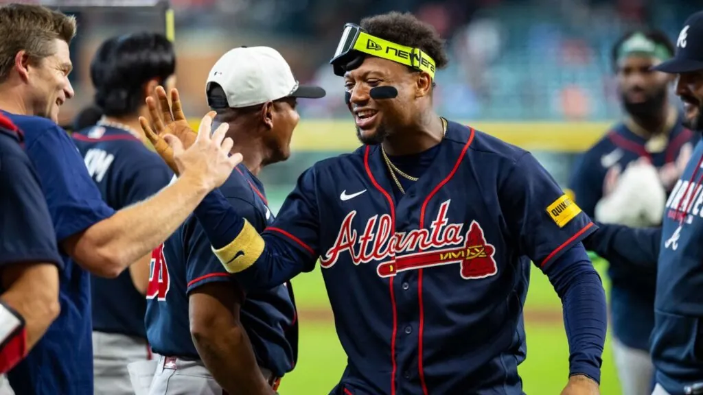 Atlanta Braves capture seventh division title in nine years An Atlanta player high-fiving his teammates after becoming NL champions