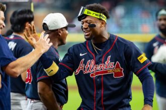 Atlanta Braves capture seventh division title in nine years An Atlanta player high-fiving his teammates after becoming NL champions