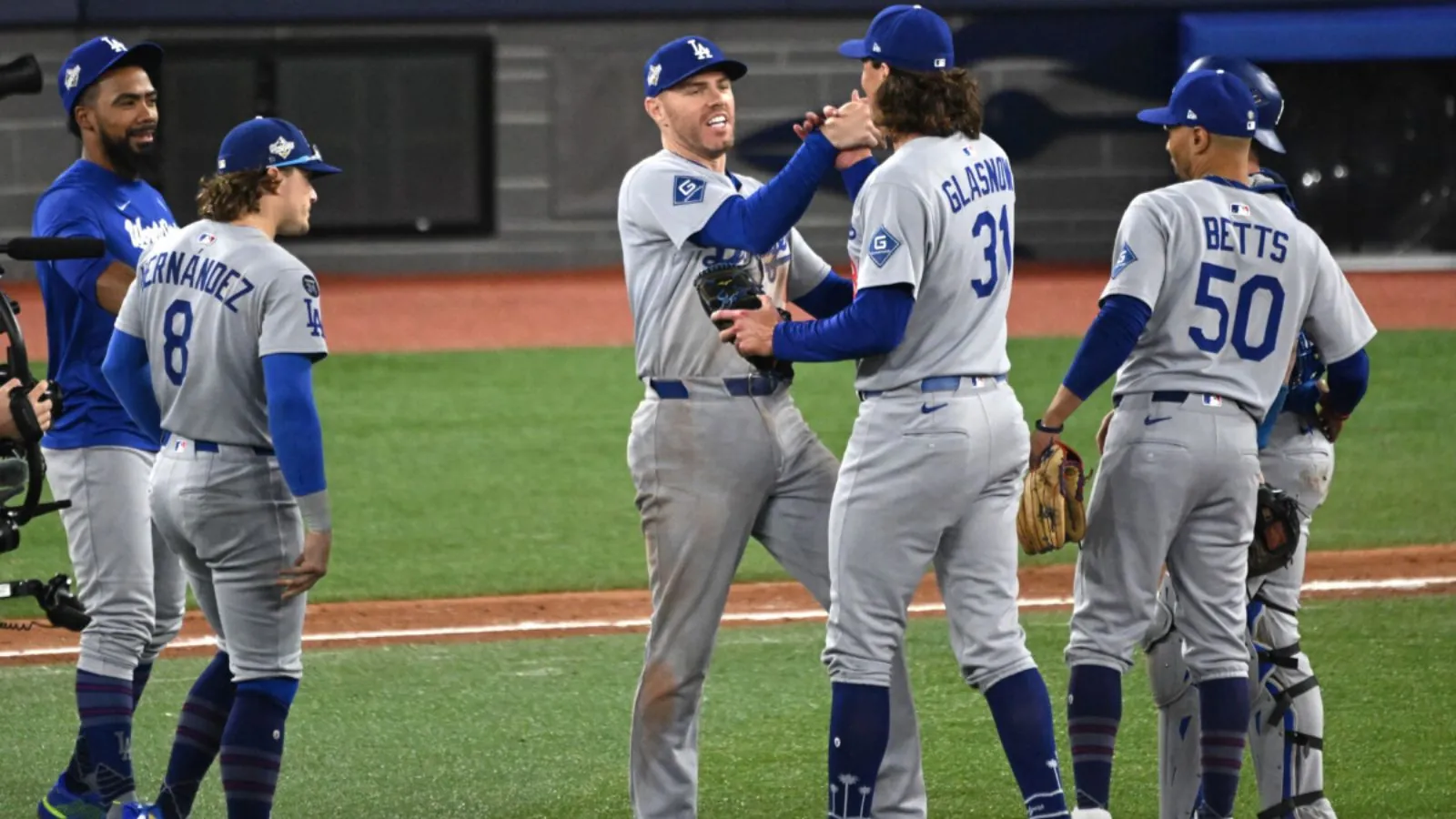 Dodgers punch their ticket to the MLB Playoffs with win over reds Several Dodgers players celebrating another victory on the pitcher's mound