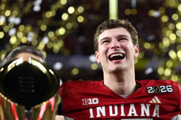 The young quarterback lifting the NCAA trophy after winning with Indiana