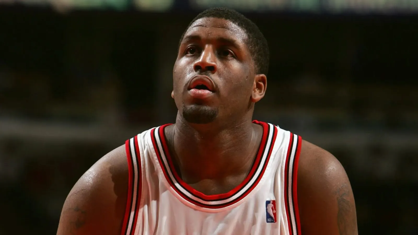 The player Michael wearing a Bulls uniform while preparing to shoot a free throw