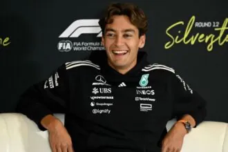 George Russell shines in Baku as Mercedes takes center stage in F1 qualifying The Mercedes driver sitting on a couch and smiling at the cameras