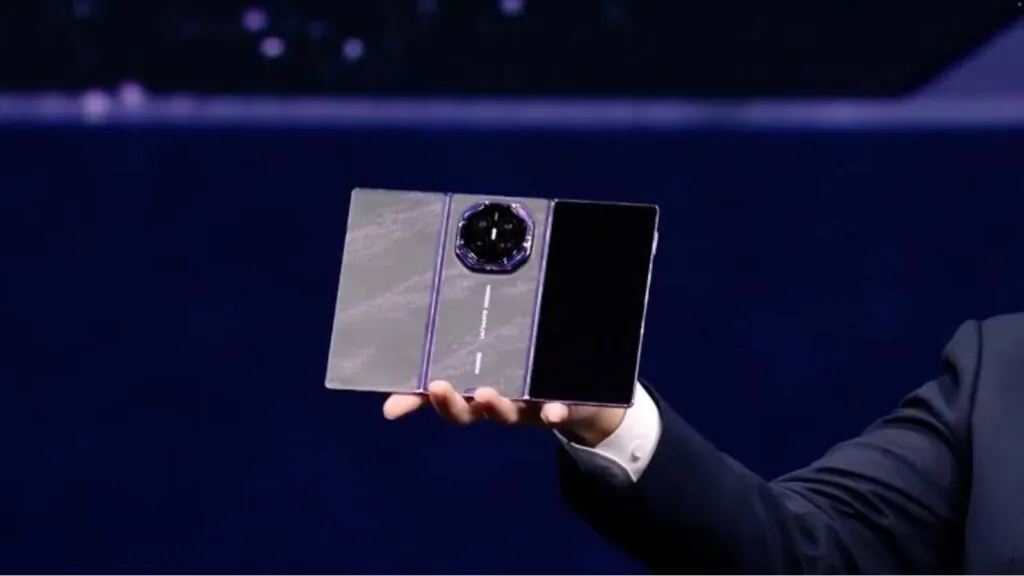 Huawei unveils Mate XT2: The $3,000 foldable phone that turns into a tablet A person holding the new Huawei triple-screen phone in their hand