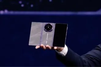 Huawei unveils Mate XT2: The $3,000 foldable phone that turns into a tablet A person holding the new Huawei triple-screen phone in their hand