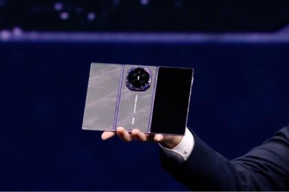 A person holding the new Huawei triple-screen phone in their hand