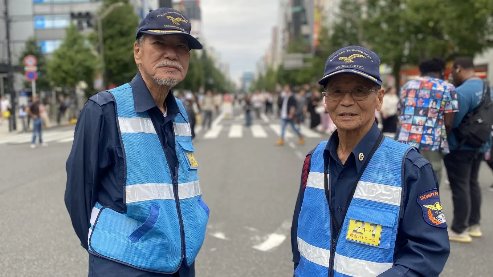 Japan breaks historic record with more than 100,000 centenarians Two elderly men working as traffic guards