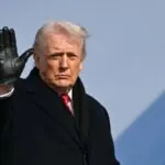 Judge blocks Trump’s latest attempt to restrict birthright citizenship in the United States Trump wearing a brand-new suit with black gloves while waving to the crowd