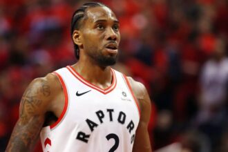 Kawhi Leonard agrees to new $115 million extension with the Toronto Raptors A young Leonard wearing a Raptors uniform, about to take a free throw