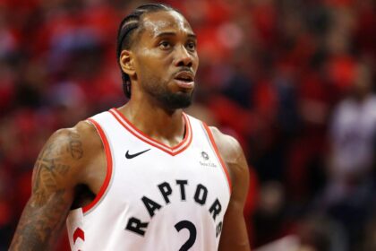 A young Leonard wearing a Raptors uniform, about to take a free throw