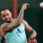 Ketel Marte throwing a baseball to one of his teammates during warm-ups