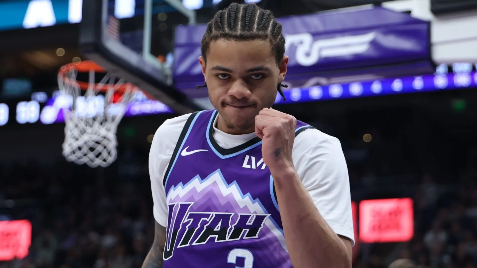 Keyonte celebrating with his fist after making an important basket