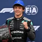 Kimi Antonelli makes history at Monza after spectacular comeback The Italian driver celebrating with his trophies while being photographed