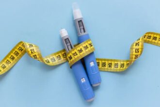 Ozempic, Wegovy and Zepbound makers face lawsuits over rare vision loss Two medication needles surrounded by a measuring tape symbolizing weight loss