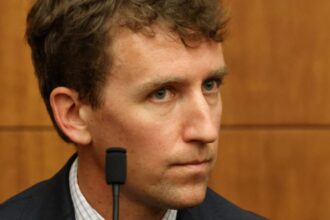 Patrick Clancy opens up about losing his children and forgiving his ex-wife Patrick sitting in a courtroom, staring intently at the woman accused of killing his children