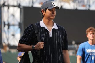 Shohei Ohtani heads to the injured list as Dodgers call up top prospect The Japanese star walking across the field in casual clothes while carrying his personal bag