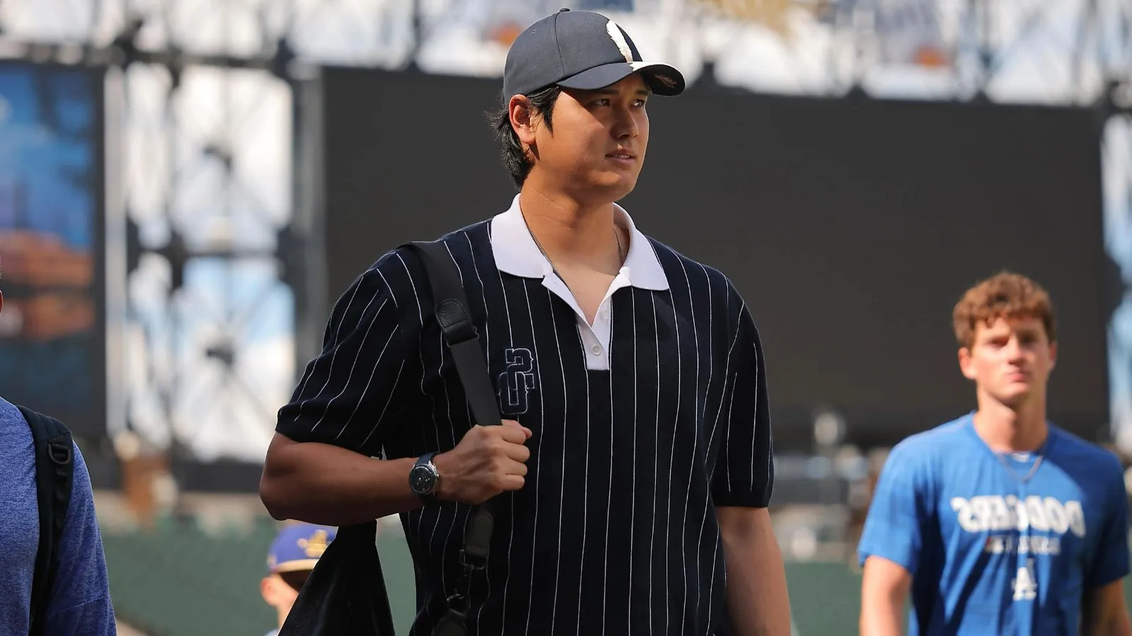 Shohei Ohtani heads to the injured list as Dodgers call up top prospect The Japanese star walking across the field in casual clothes while carrying his personal bag
