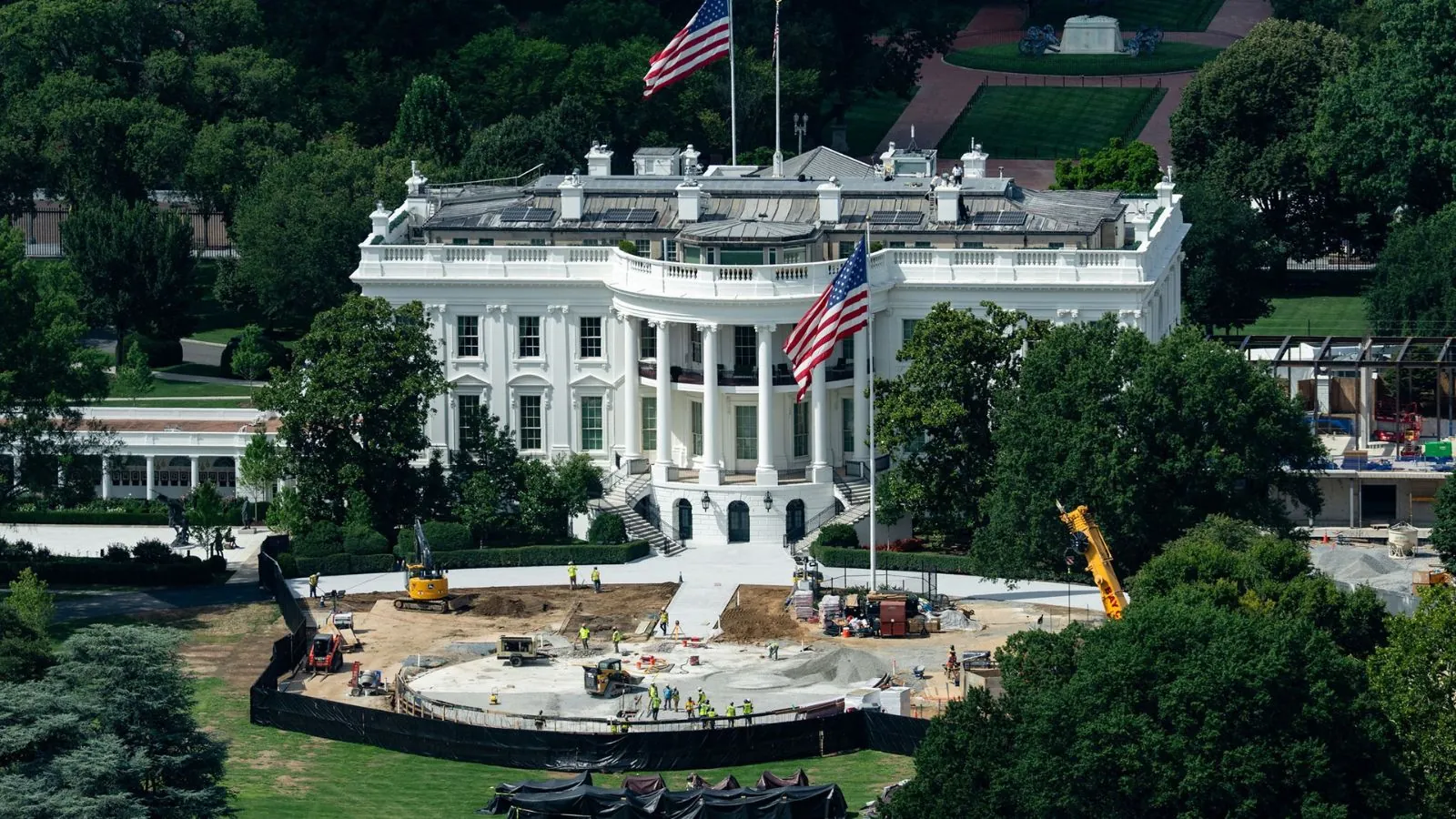 Trump blocks CNN, MS NOW and Politico from the White House A panoramic image of the White House, with renovations taking place in certain parts of its garden