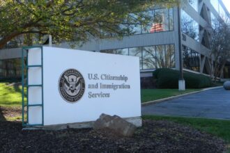 Trump’s new Green Card Rule sparks controversy over public benefits One of the U.S. Citizenship and Immigration Services offices with its logo