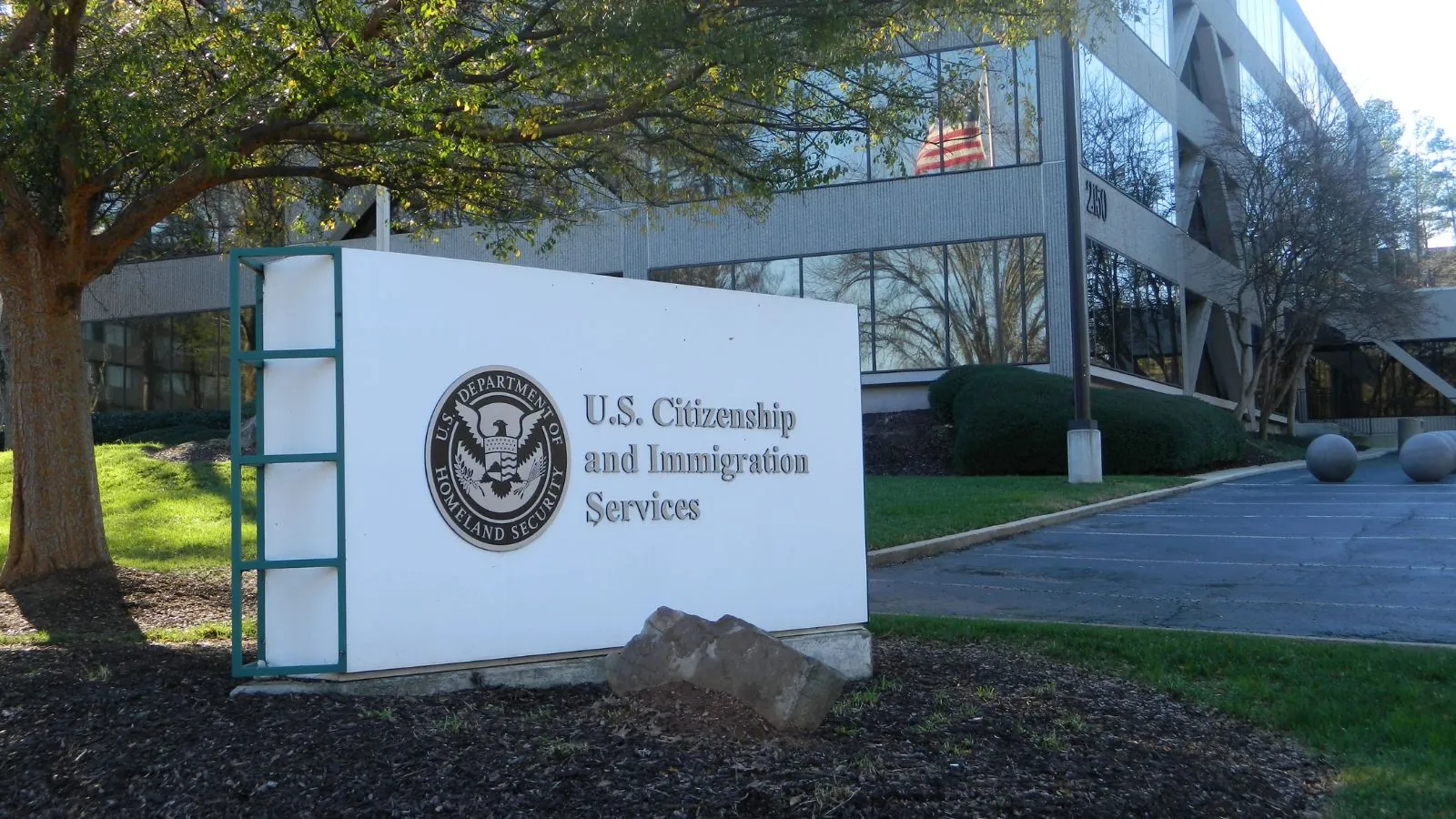 Trump’s new Green Card Rule sparks controversy over public benefits One of the U.S. Citizenship and Immigration Services offices with its logo