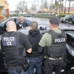 United States homeowner accused of using ICE threat to avoid paying latino workers Several ICE agents escorting a Latino man into one of their vehicles