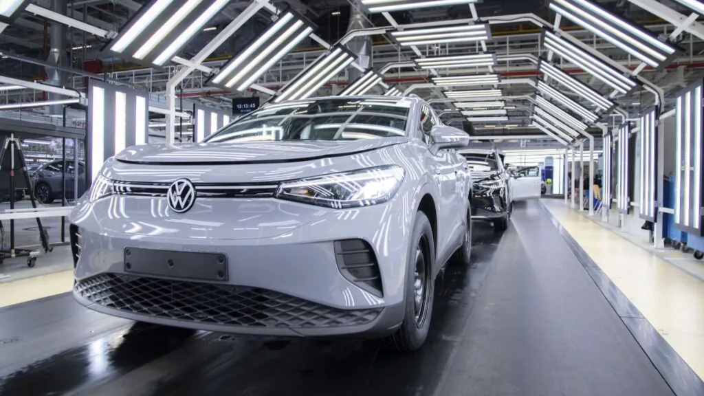 Volkswagen shakes up the industry: 50,000 jobs to be cut as german plants face review A Volkswagen plant putting the finishing touches on a white vehicle