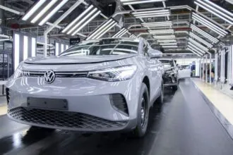 A Volkswagen plant putting the finishing touches on a white vehicle