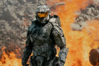 Xbox makes a stunning move as activision takes over the next Halo game The main character of the game walking amid explosions