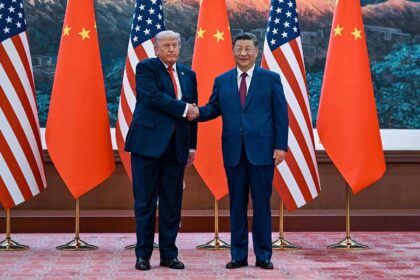 The presidents of both powers shaking hands while being photographed
